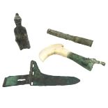 A STUDY GROUP OF FOUR CHINESE ARCHAISTIC ITEMS comprising a chariot fitting, a staff handle, a