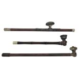 THREE CHINESE HARDWOOD AND METAL-MOUNTED OPIUM PIPES QIMG DYNASTY, 19TH CENTURY with Yixing