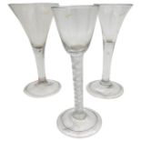 A GEORGE III WINE GLASS, CIRCA 1800, heavy baluster bowl on a multiple series air twist stem, raised