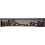 A JAPANESE CARVED WOODEN ROOM DIVIDER/OVERDOOR WITH A TOWER AND TREES,