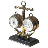 A MARITIME THEMED CLOCK/BAROMETER DESK COMPENDIUM, the anchor shaped support flanked by a clock and