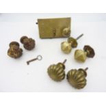 A GEORGE III BRASS AND STEEL DOOR LOCK, FOUR POLE FINIALS AND A PAIR OF DOMED-FACET BRASS DOOR