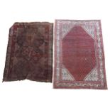 A HAND KNOTTED SAROUK RUG AND A WORN BELOUCH RUG, 20TH CENTURY, the Sarouk with biege border pattern