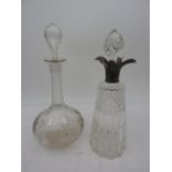 A SILVER MOUNTED CUT GLASS DECANTER, SHEFFIELD 1907, AND ANOTHER CUT AND VINE ENGRAVED GLASS