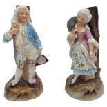 A PAIR OF LATE 19TH/EARLY 20TH CENTURY CONTINENTAL PORCELAIN FIGURAL CANDLEABRA BASES, modelled as a