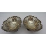 A PAIR OF LATE VICTORIAN SILVER BON BON DISHES, oval form, ornate pierced trellis work sides with
