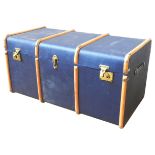 A VINTAGE BENTWOOD TRAVEL TRUNK, covered in navy blue canvas