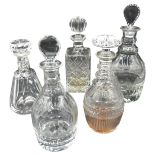 A GROUP OF FIVE GLASS DECANTERS, 19TH/20TH CENTURY, the lot comprised of three elegant 19th '