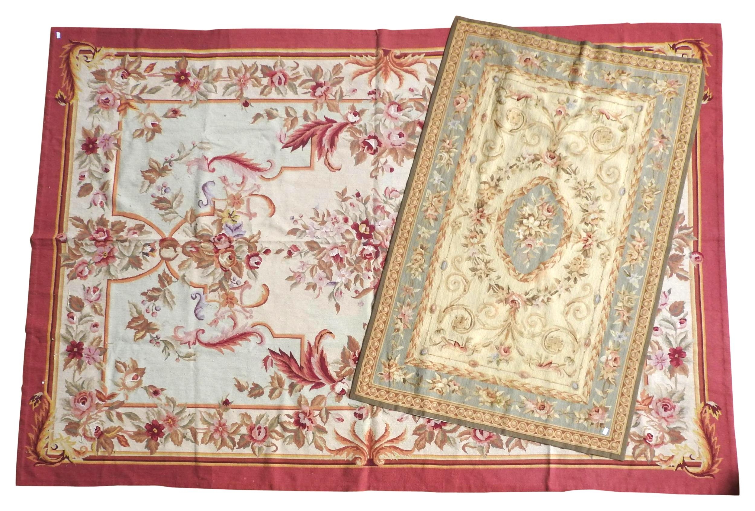 TWOFRENCH AUBUSSON CARPETS, 20TH CENTURY, the lot comprised of a large red border rug (300 x 205