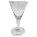 A GEORGE III LARGE WINE GOBLET, CIRCA 1820, the drawn trumpet bowl etched with the initials 'W.J.C',