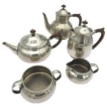 A LIBERTY FIVE PEWTER TEA SET with hammered finish marked 'Made by Liberty & Co English Pewter'.