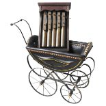 A VINTAGE DOLLS PRAM AND WALL MOUNTED CHIMES, the pram carriage with leatherette covered interior,