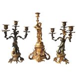 A PAIR OF GILT BRONZE FIGURAL CANDELABRA AND A CANDLESTICK, LATE 19TH CENTURY, the three light