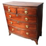 A GEORGE III MAHOGNY BOW FRONT CHEST OF DRAWERS, two short drawers over three graduated long