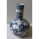 A LARGE CHINESE BLUE AND WHITE BOTTLE VASE, 20TH CENTURY, the sides profusely decorated with scaly