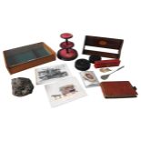 A MAHOGANY BOOK HOLDER, A SMALL TABLE TOP MERCHANTS CASE, A LEATHER LEDGER, A TURNED WOODEN STAND