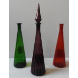 THREE VINTAGE EMPOLI ITALIAN GLASS 'GENIE' BOTTLES, CIRCA 1965, conical fluted form, in amethyst,