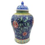 A LARGE CHINESE FAMILLE ROSE VASE AND COVER, 20TH CENTURY, baluster form, the sides decorated in the