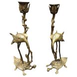 A PAIR OF LACQUERED BRASS CANDLESTICKS, EARLY 20TH CENTURY, each naturistically modelled as a