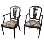 A PAIR OF GEORGE III HEPPLEWHITE STYLE MAHOGANY ELBOW CHAIRS, CIRCA 1820, balloon backs with splayed