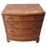 A WALNUT VENEER BOW FRONT CHEST OF DRAWERS, 20TH CENTURY, in the George III manner, rectangular