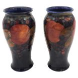A PAIR OF VINTAGE MOORCROFT 'POMEGRANATE' VASES, CIRCA 1935, baluster form with underglaze and