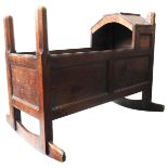 A LATE 17TH/EARLY 18TH CENTURY OAK PANELLED CRADLE, with flat panel arch canopy and chamfered