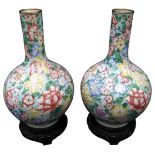 A PAIR OF CHINESE ENAMELLED BOTTLE VASES, 20TH CENTURY, the globular bodies and slender necks