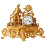 A LOUIS XV STYLE GILT METAL MANTLE CLOCK, CIRCA 1900, the drum shaped clock case with 8 cm enamelled