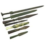 TWO ARCHAISTIC CHINESE BRONZE SWORDS together with A GROUP OF FIVE CHINESE SPEARHEADS (7) largest