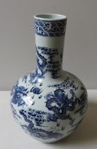 A LARGE CHINESE BLUE AND WHITE BOTTLE VASE, 20TH CENTURY, the sides profusely decorated with scaly