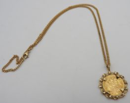 A 1915 HALF SOVEREIGN IN A 9CT GOLD MOUNT, suspended from a 9ct gold chain Gross weight: 15.5 grams