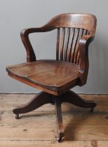 A VINTAGE AMERICAN MAHOGANY SWIVEL CHAIR, manufactured by the B.L Marble Chair Company, Bedford,