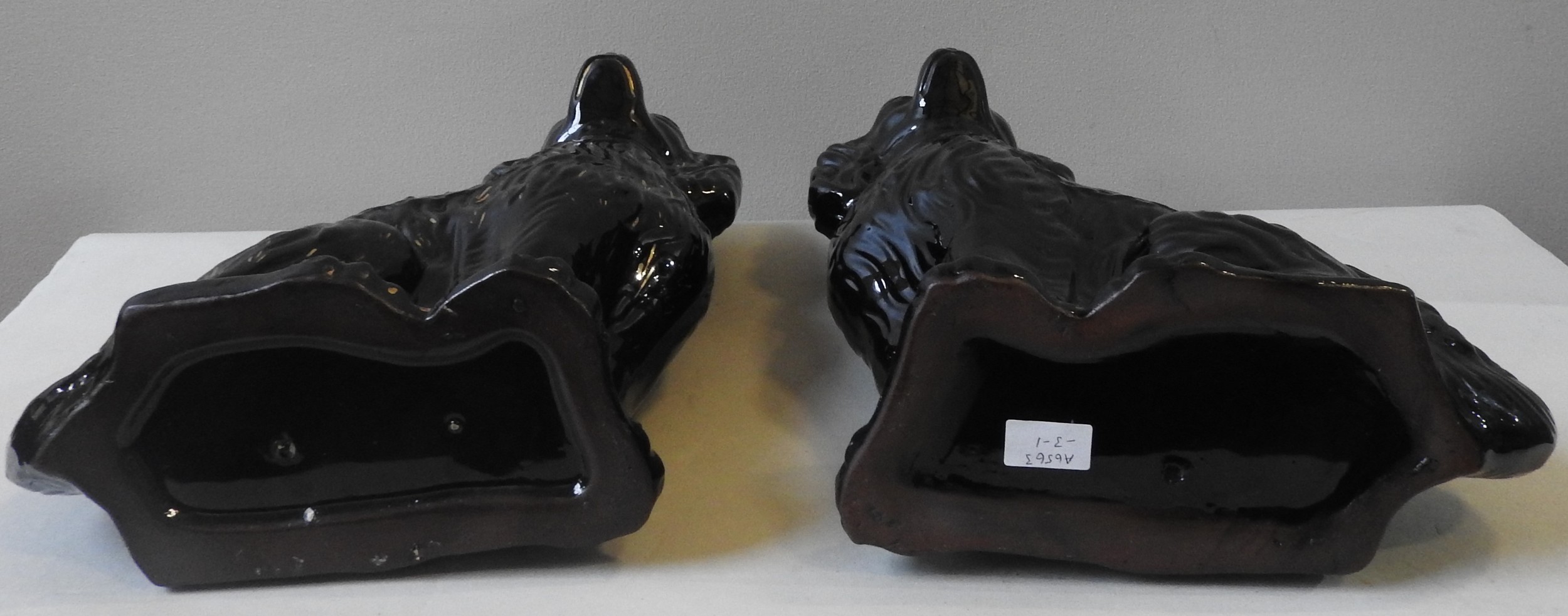 TWO BLACK GLAZED STAFFORDSHIRE SPANIEL FIGURES, 20TH CENTURY, in the Victorian style, with gilded - Image 3 of 3