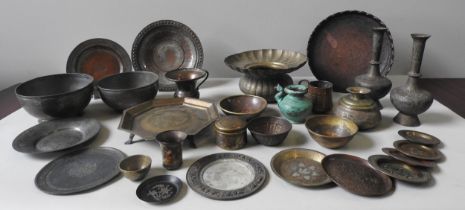 A SELECTION OF PERSIAN AND INDIAN BRASS AND COPPER WARES including chargers, vessels, bowls,
