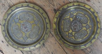 A PAIR OF BRASS CAIRO WARE DISHES, EARLY 20TH CENTURY, with concentric bands of decoration and