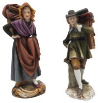 A MATCHED PAIR OF VOLKSTEDT PORCELAIN FIGURES, EARLY 20TH CENTURY, of lady and gent travellers