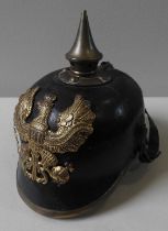 A PRUSSIAN PICKELHAUB, EARLY 19TH CENTURY, the leather helmet mounted with brass finial and  pressed