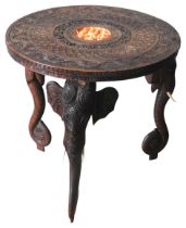 AN INDIAN CARVED PADOUK WOOD CIRCULAR TABLE, 19TH CENTURY AND LATER, the circular 19th century top