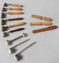 A GROUP OF NINE VINTAGE GUNPOWDER MEASURES, mostly French, six with turned wooden handles, three