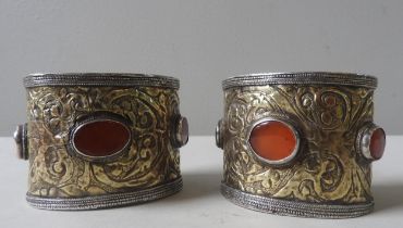 A PAIR OF TURKOMAN SILVER WIDE CUFF BRACELETS, LATE 19TH/EARLY 20TH CENTURY, the sides with gilded