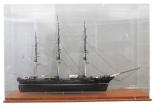 A PLASTIC KIT MODEL OF THE CUTTY SARK, MID 20TH CENTURY, assembled and mounted in a perspex case