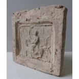 A CHINESE STONE TOMB TILE, the square tile decorated in low relief depicting a polo player on
