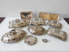SIX SILVER PLATED SERVING DISHES WITH COVERS, various shapes and styles, along with a scroll edge
