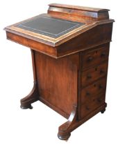 A LATE VICTORIAN WALNUT DAVENPORT, CIRCA 1875