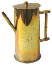 A FIRST WORLD WAR TRENCH ART TEA POT, the body formed from a shell case with handle and angled spout