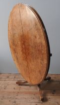 A WALNUT LOO TABLE, 19TH CENTURY, the tilting oval top raised on a baluster turned pedestal raised