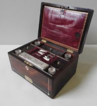 AN EARLY VICTORIAN ROSEWOOD VANITY CASE, CIRCA 1840 ,with mother or pearl line inlay and inset