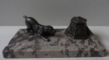 A VINTAGE ART DECO INK STAND, CIRCA 1920, the grey marble stand surmounted by a cast metal figure of