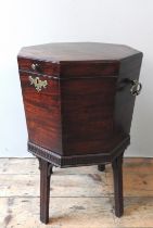 A GEORGE III MAHOGANY WINE COOLER, CIRCA 1790, tapered octagonal form, the hinged cover enclosing an